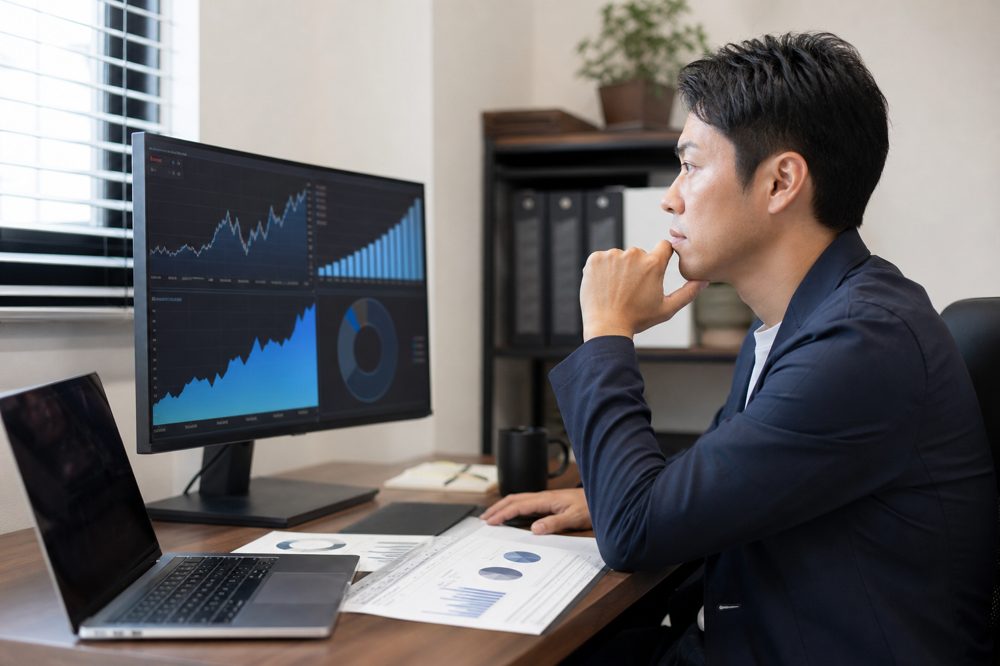 中小企業経営者がオフィスでAI投資のROI分析資料を確認している